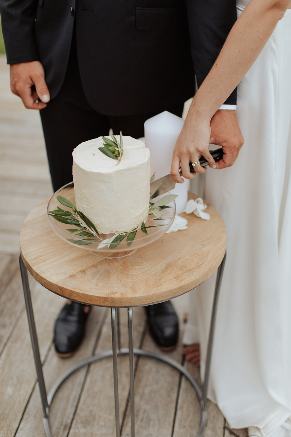New Zealand Russell Elopement bride and groom cutting cake